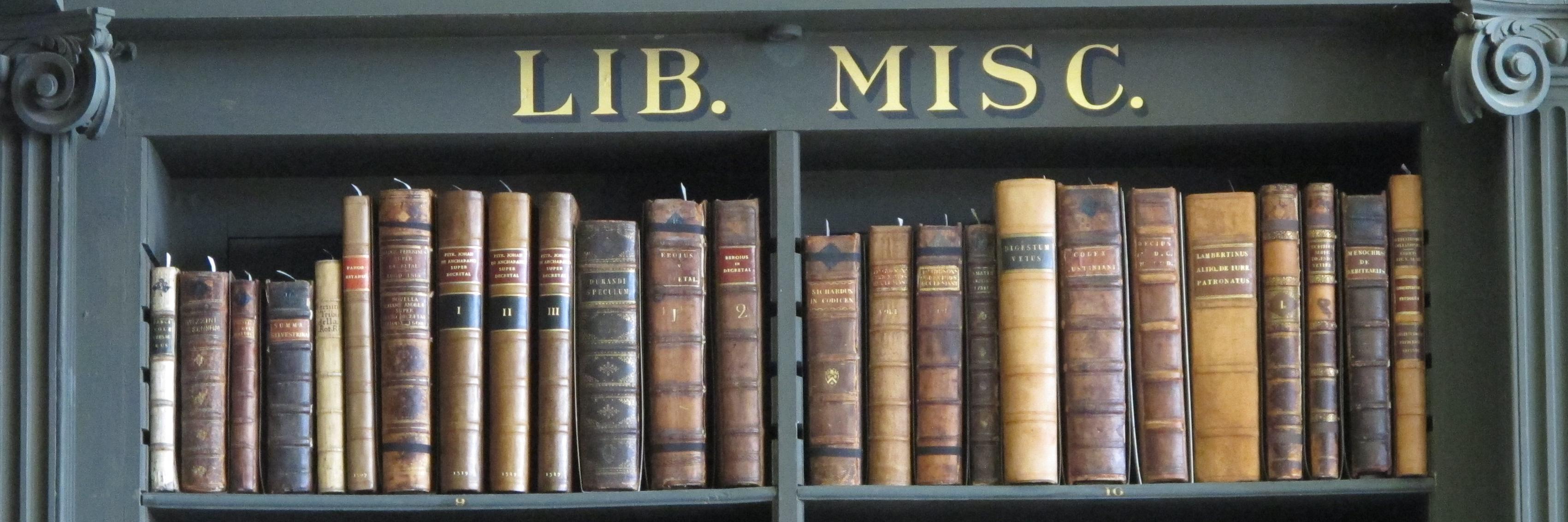 Shelf of books; with label 'Lib. Misc' above